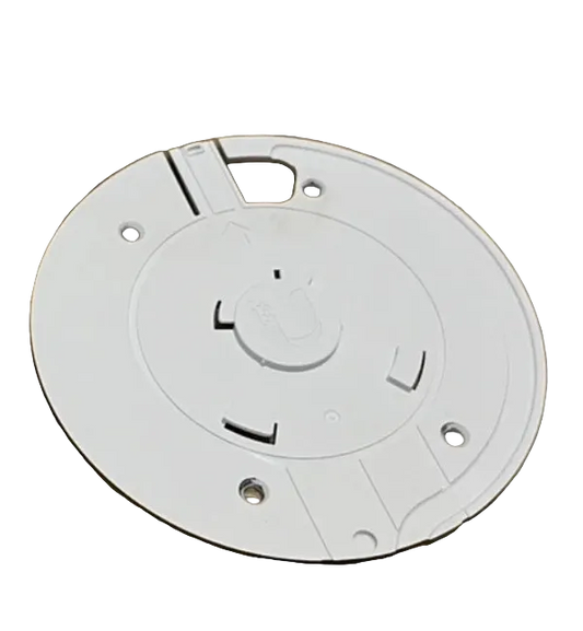 White security camera and mounting bracket on a wooden surface