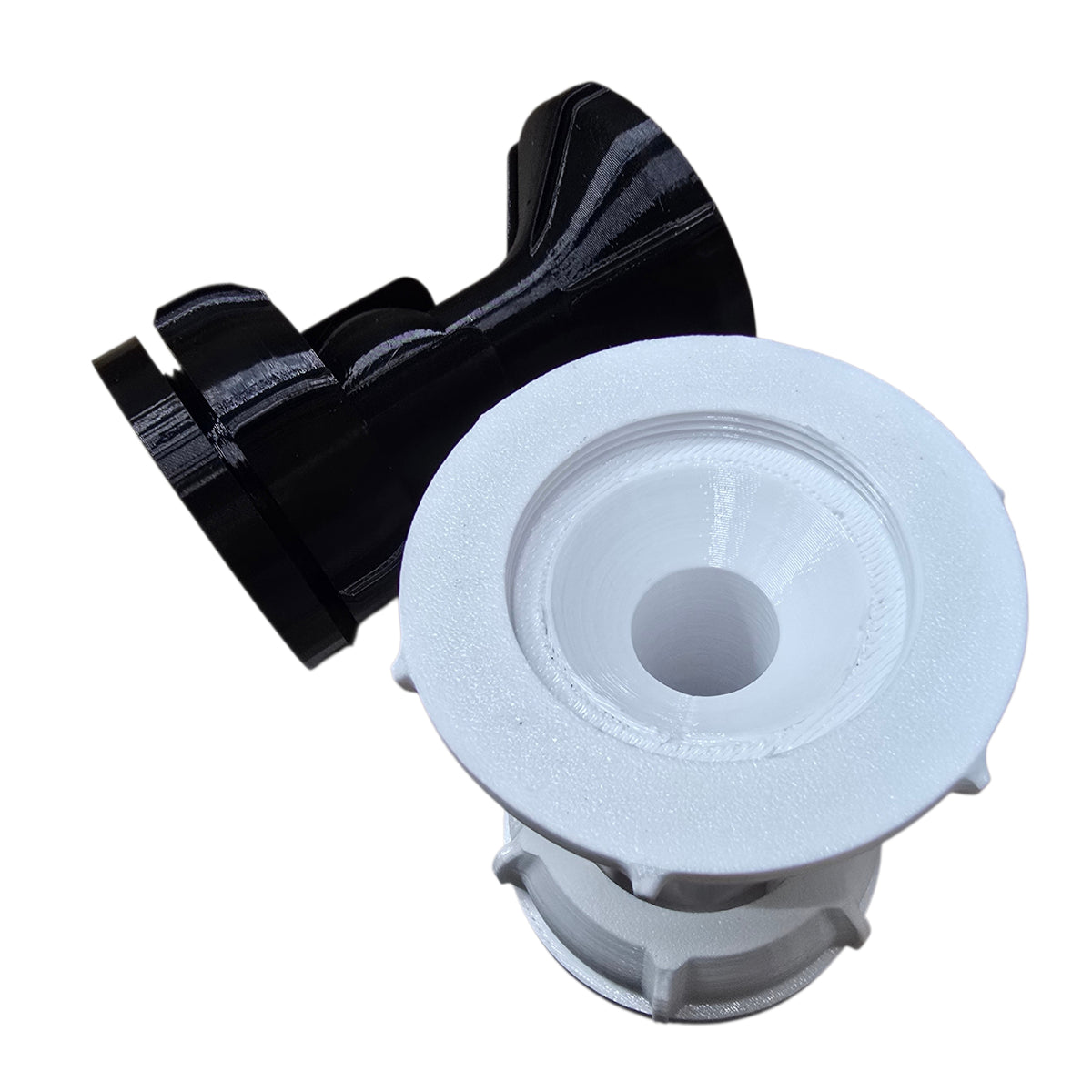 White plastic component with black flexible hose on a white background